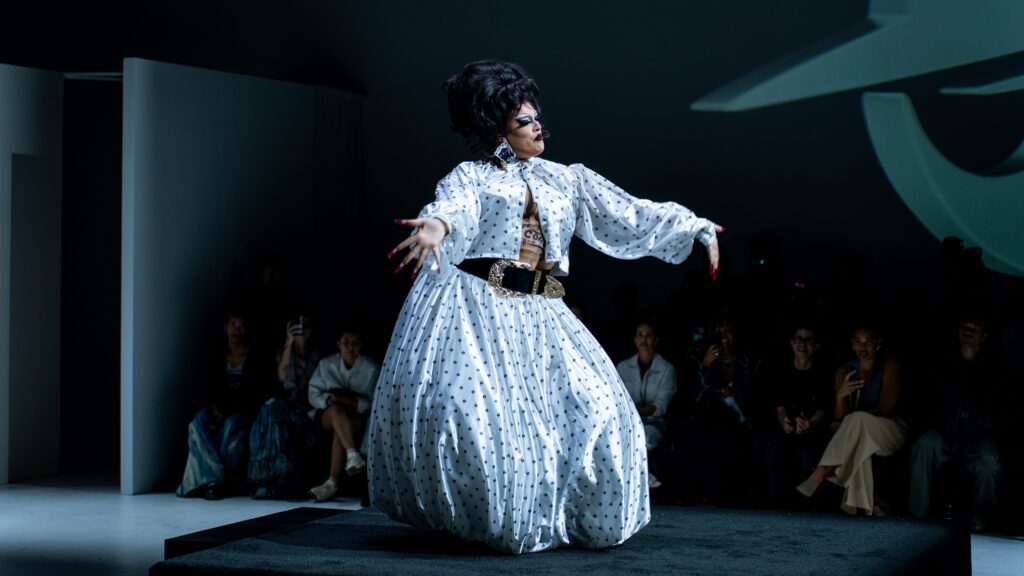 A Model Channels Emotion on the Runway Artistic close-up of a model on a runway, her emotional expression showing she is a medium for the designer's artistic vision.