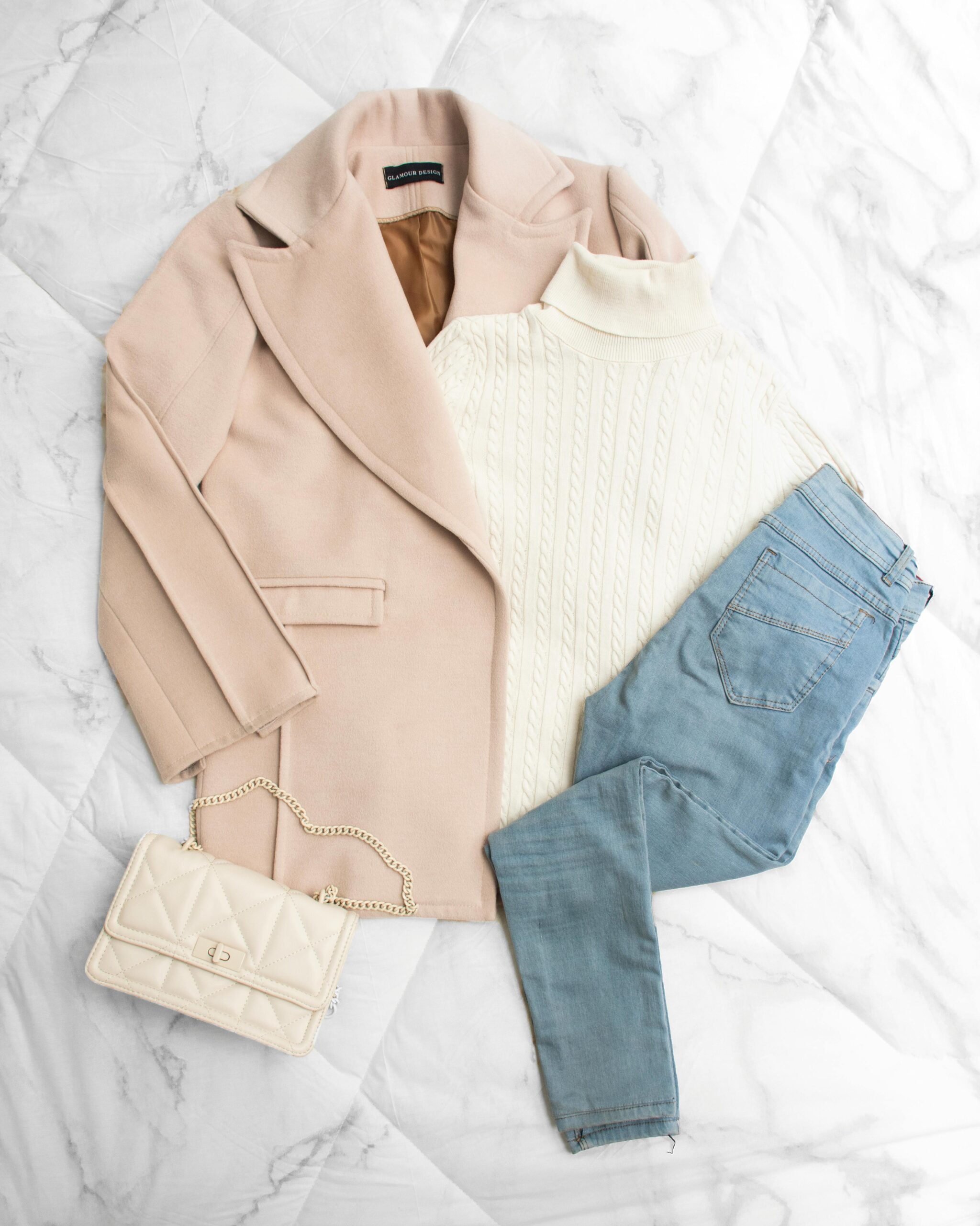 The 10-Piece Capsule Wardrobe: A Framework for Smart Casual Style 1 An artistic flat lay of a blazer and jeans with architectural tools, illustrating the process of building a smart casual capsule wardrobe with an intentional framework.