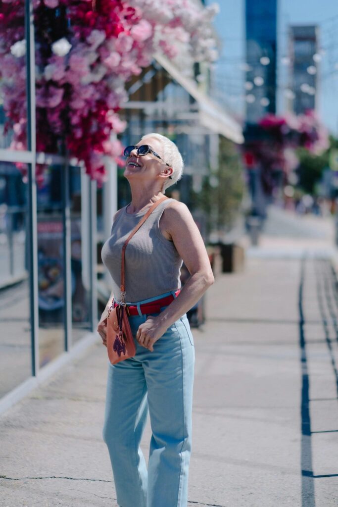 The Ghost in Your Closet: A Strategic Guide to Dressing for New Beginnings 3 Close-up of a well-dressed woman in a blazer and soft sweater, showcasing the elements of strategic dressing for a cohesive look.