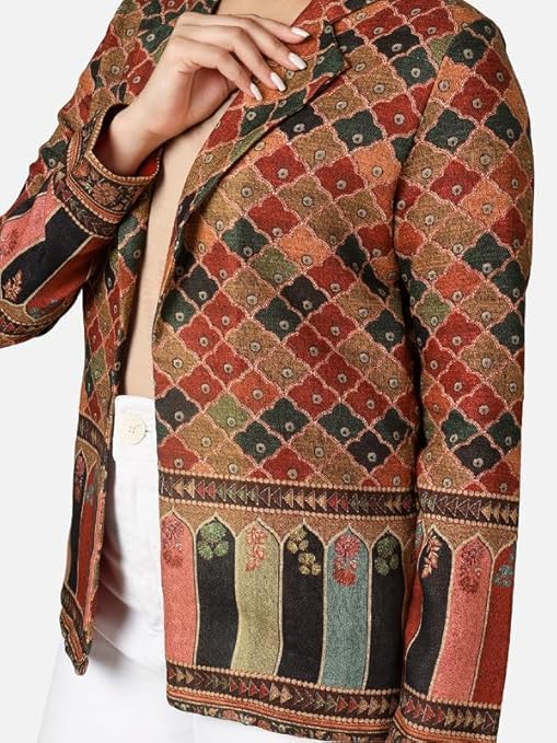 The Modern Woman’s Festive Playbook: Three Ways to Channel Intelligent Glamour 4 A woman pairs a traditional embroidered skirt with a modern white shirt, demonstrating creative and innovative festive dressing.