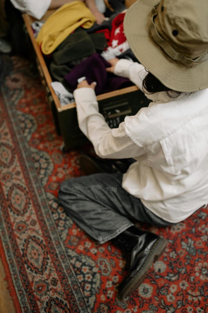 More Than a Mood: The Real Science of Dopamine Dressing 4 A diptych showing hands opening a new package and a person fondly holding a cherished old garment, representing novelty and nostalgia in dopamine dressing.