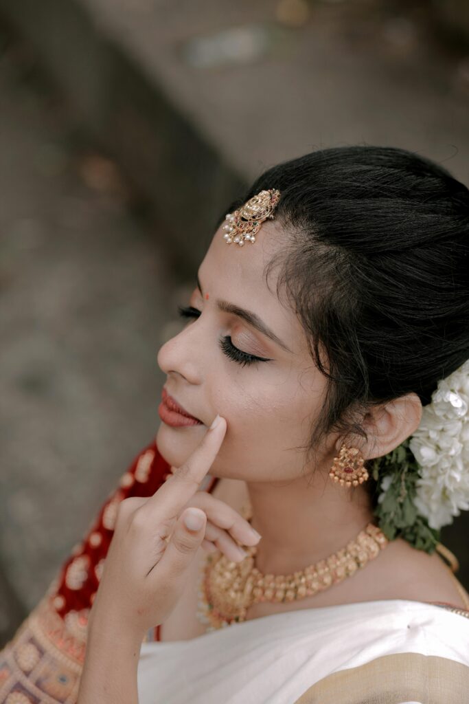 The Modern Woman’s Festive Playbook: Three Ways to Channel Intelligent Glamour 5 Women in a festive dressing, makeup with simple hairstyle with flowers, and have simple subtle makeup.