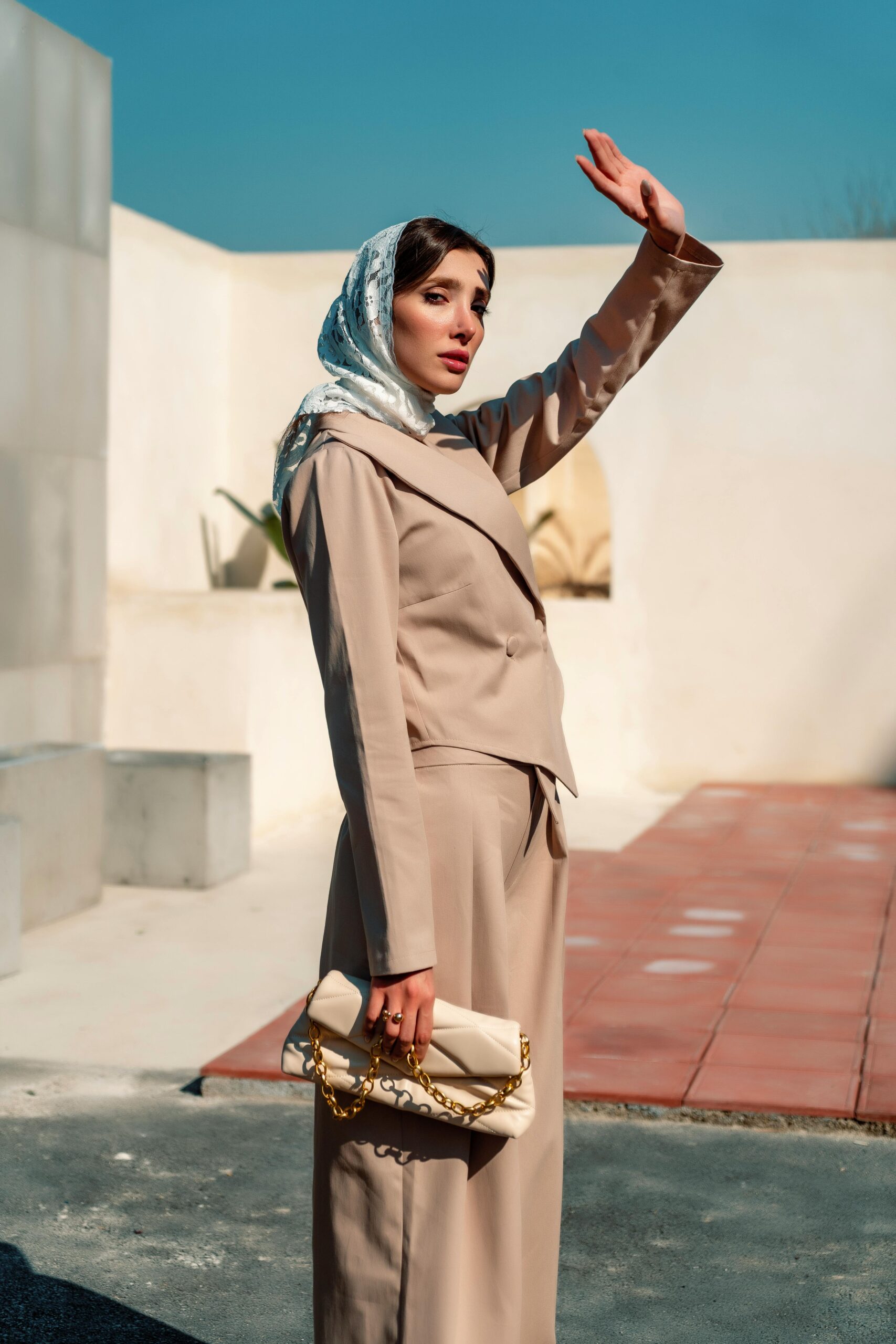 A woman in a polished, monochromatic outfit demonstrating how to look expensive with minimalist style.
