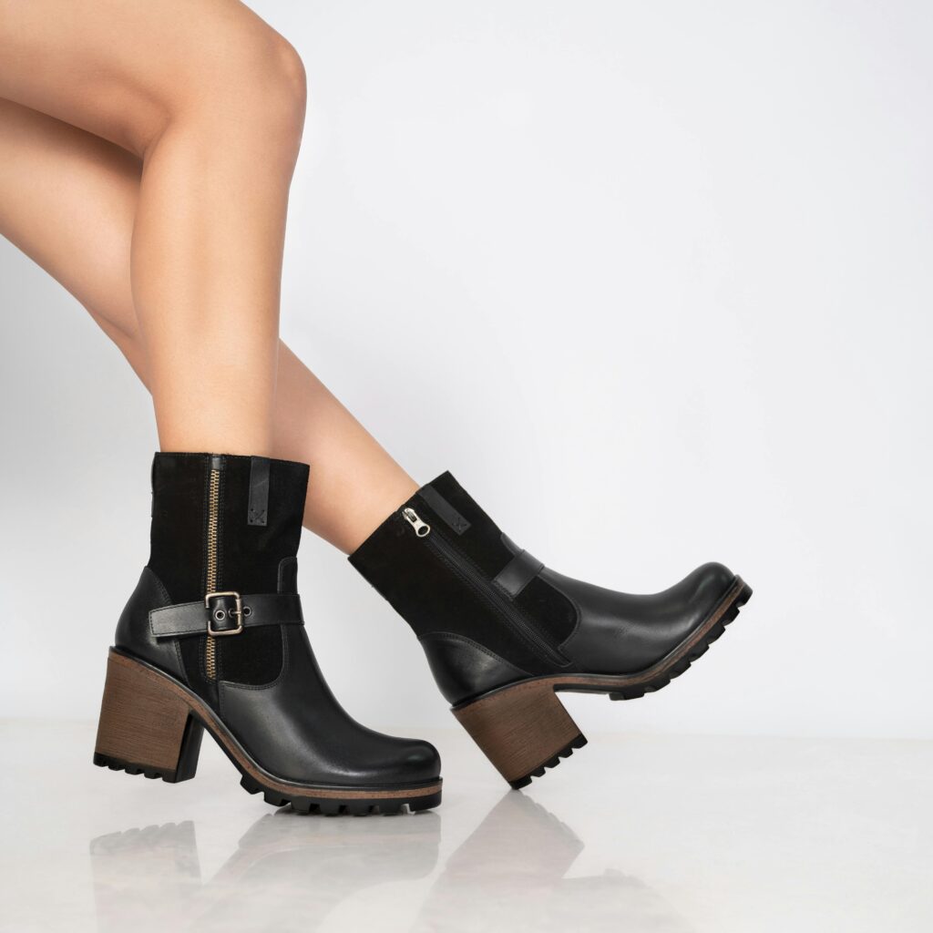 A sleek ankle boot with a clean silhouette, showcased as a foundational shoe in a modern shoe wardrobe.
