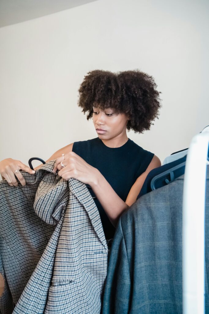 Checking clothes during wardrobe decluttering